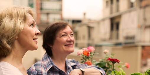 Two older women gardening